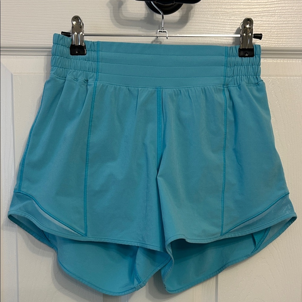 Lululemon Hotty Hot 4” lined shorts. Size 4. Turquoise. Two small stains on back